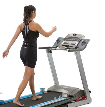 Woman walking on a treadmill.